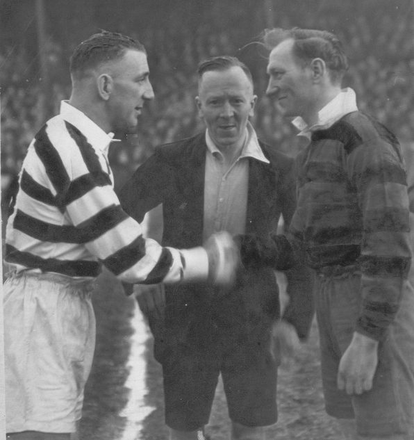 Edgar Brooks shakes hands with the Broughton Moor captain - Feb 12th 1949.