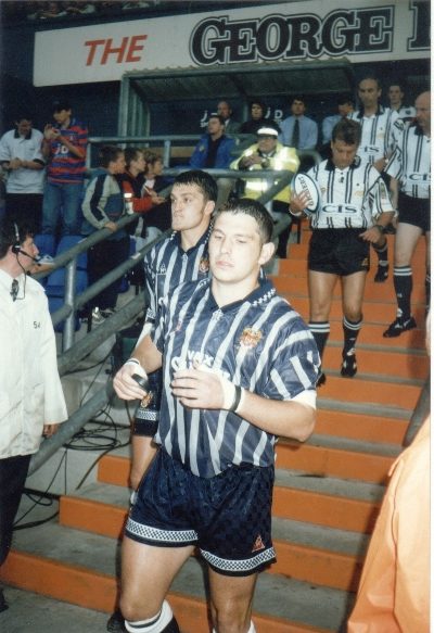 David Stephenson followed by Gary Lord take the field v Adelaide July 25th 1997.