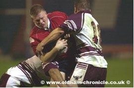 Adam Sharples is held in a two man tackle. -Nov 19th 2003.