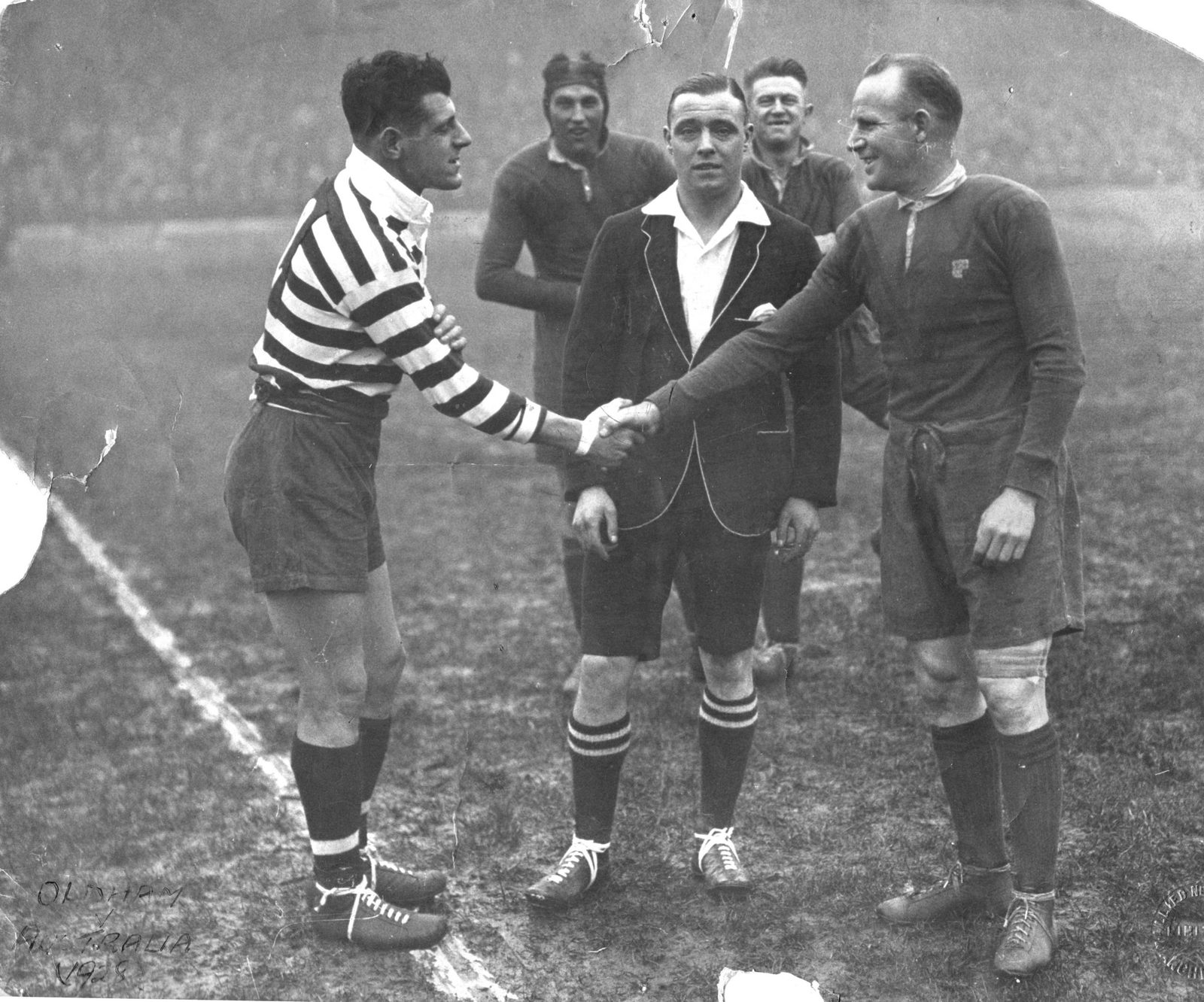 Rival captains, Syd Rix and Tom Gorman shake hands under the watchful eye of referee, Mr. F. Peel of Bradford.