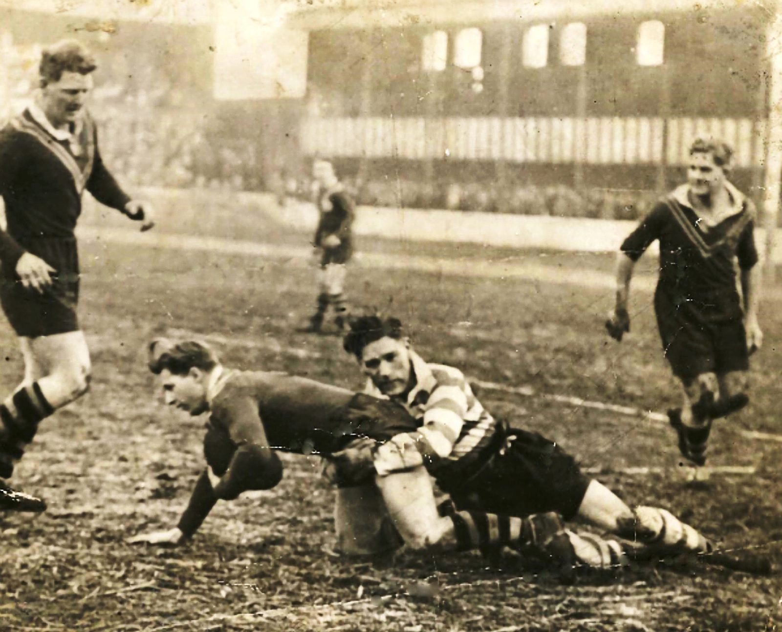 Jack `Duchy’ Holland on the left, Bob Lulham being tackled by John Donegan and Fred de Belin on the right. Dec 4th 1948.