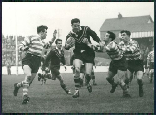 Terry O'Grady, Alan Davies and Ken Jackson move in on Kel O'Shea. Nov 7th 1956.