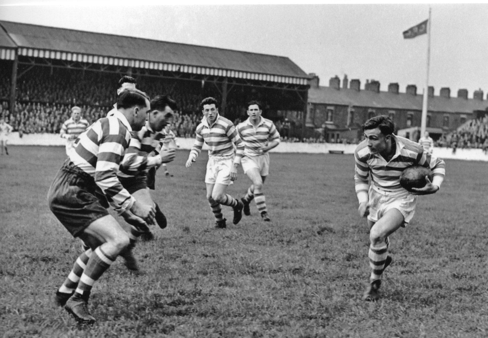 Bryn Goldswain and Dick Cracknell move in on Norman Field - Aug 21st 1954.