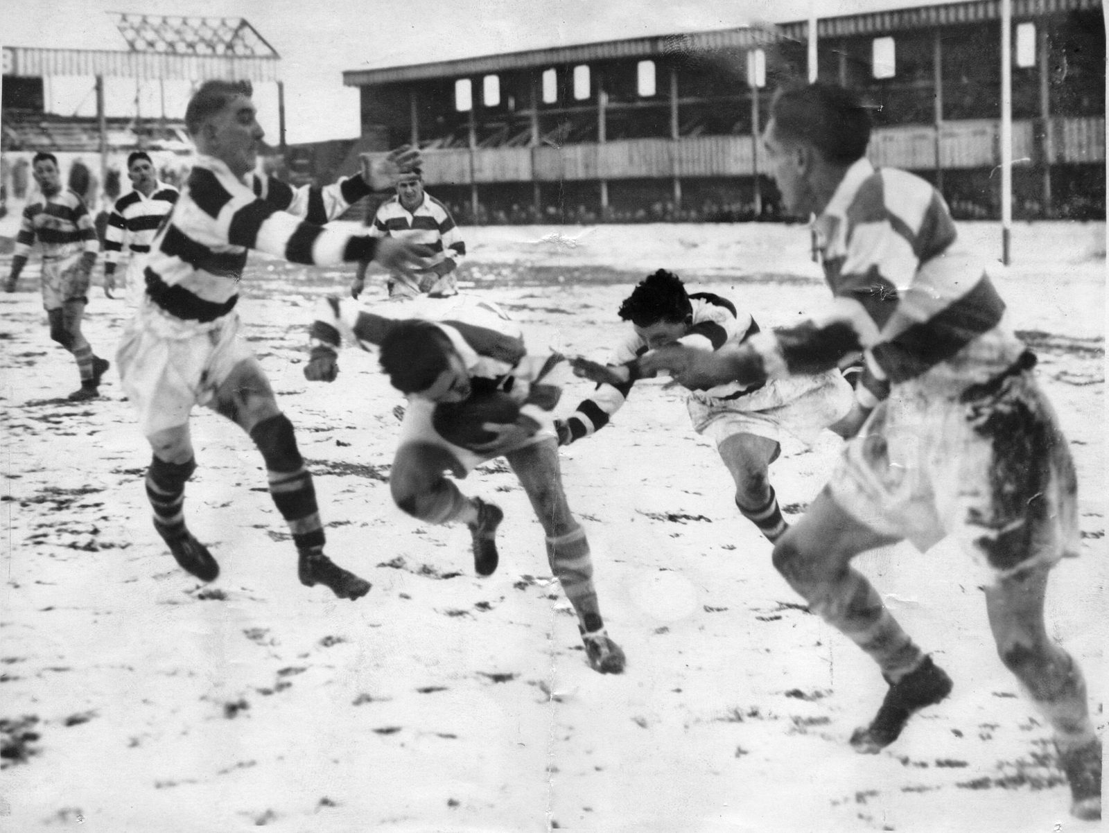 Edgar Brooks and Harry Ogden tackle Powell while Stan McCormick (Belle Vue) waits in the wing - Feb 22nd 1947.