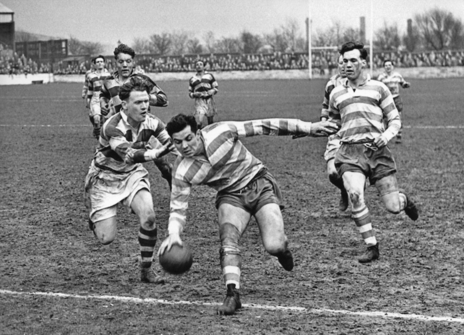 Alan Davies evades Arthur Gregory to touch down against Belle Vue backed up by Terry O'Grady - April 17th 1954.