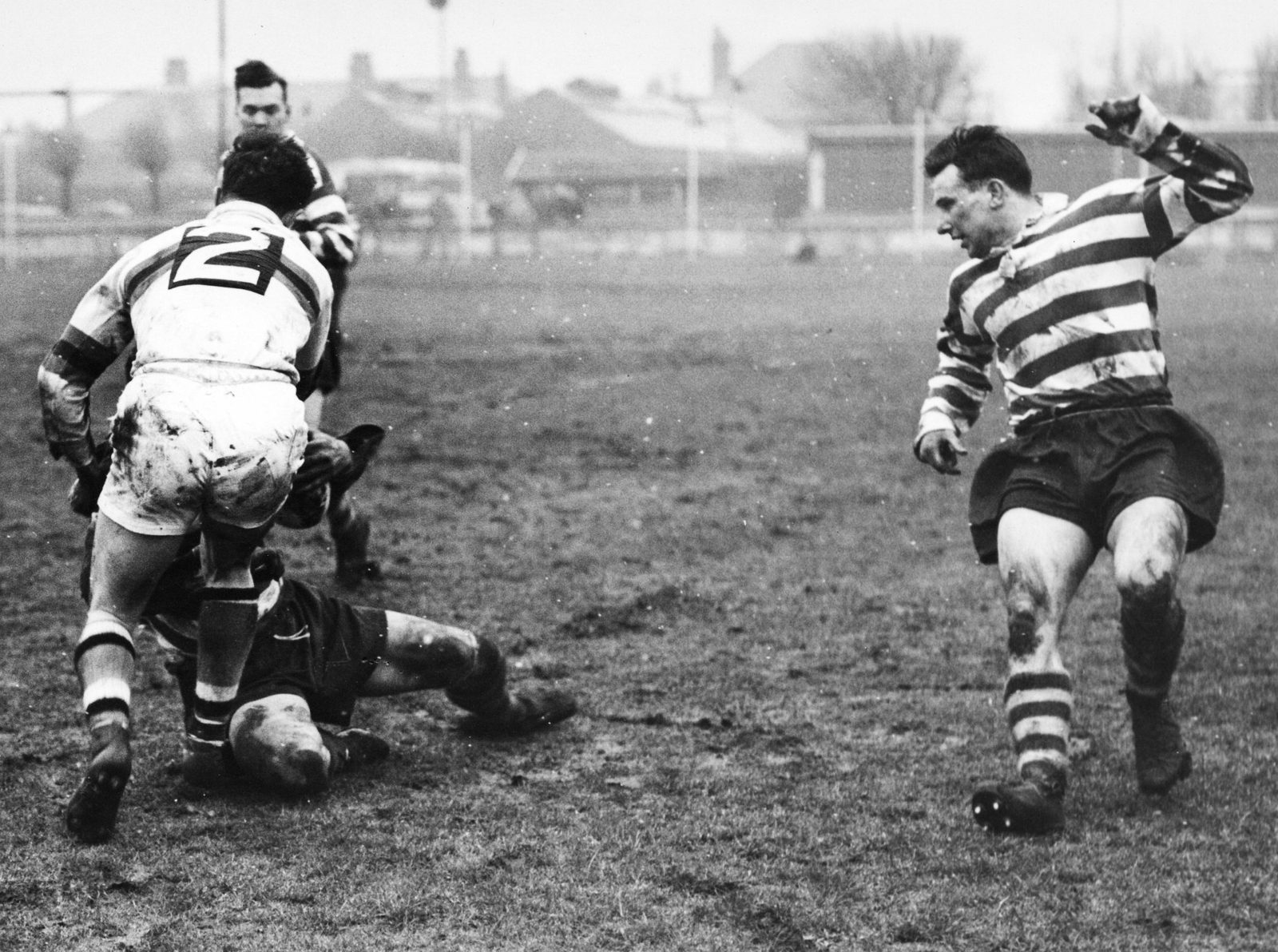 Emmitt tackles an Oldham player watched by Pitchford - Feb 22nd 1958.