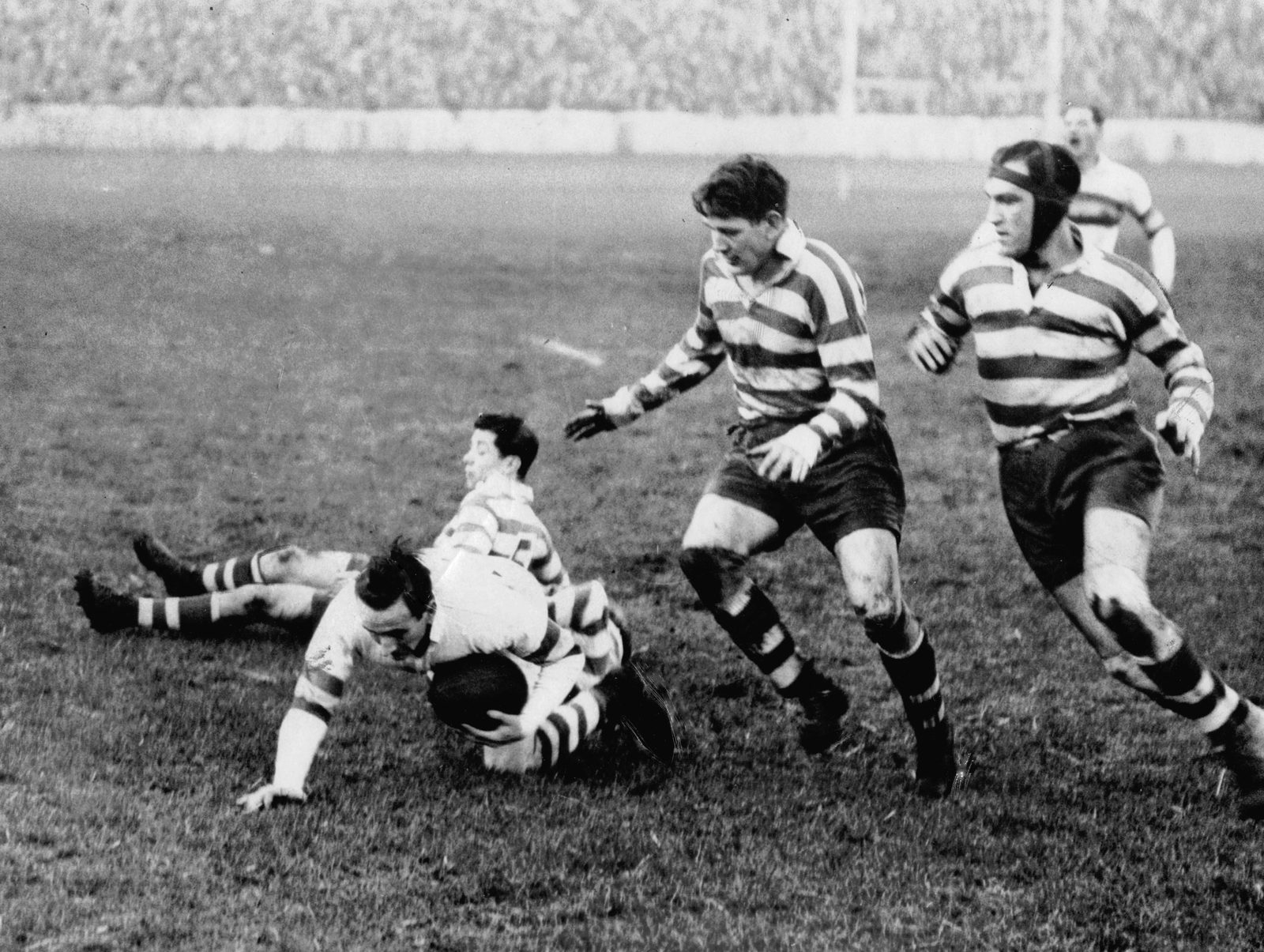 Les Anthony and Charlie Winslade move in on a Bradford opponent - Dec 29th 1951.