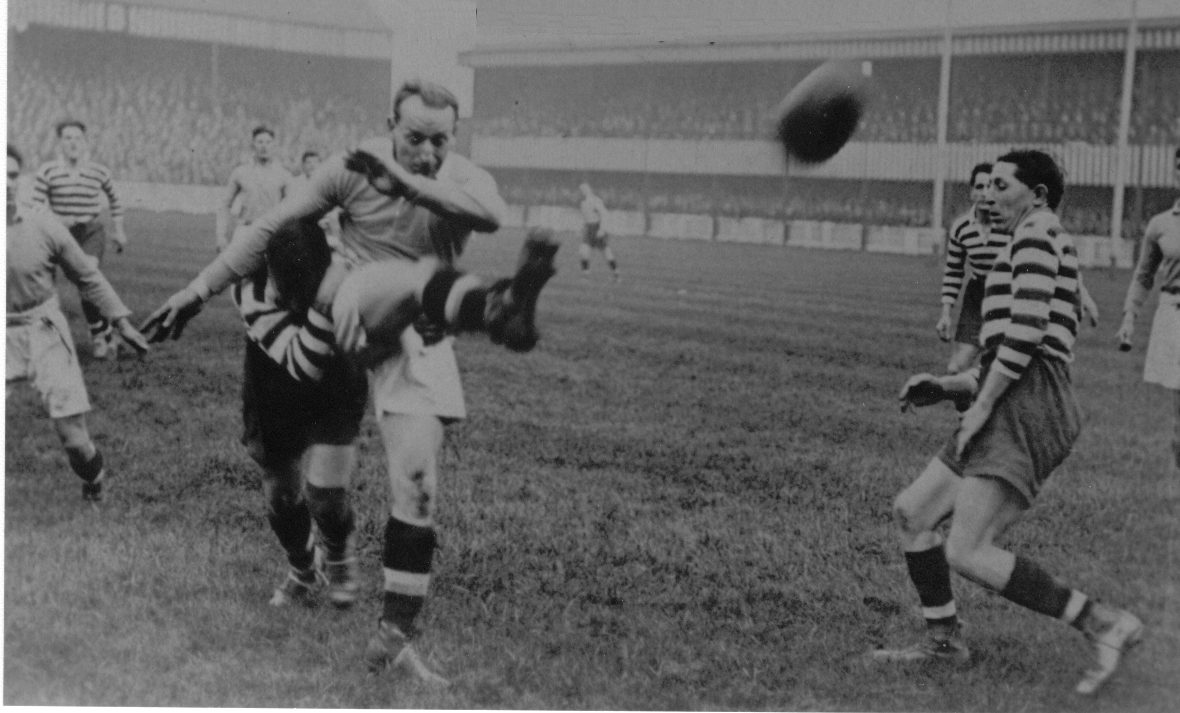 Action v Halifax with Tommy Hurtley, Joe Corsi and Evan Davies in the background - Sep 27th 1924.