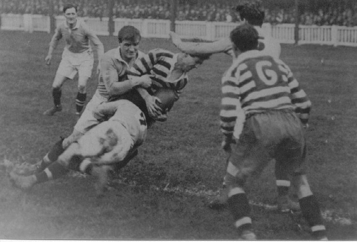 Tommy Hurtley is tackled by Halifax defenders with George Hesketh in support - Sep 27th 1924.