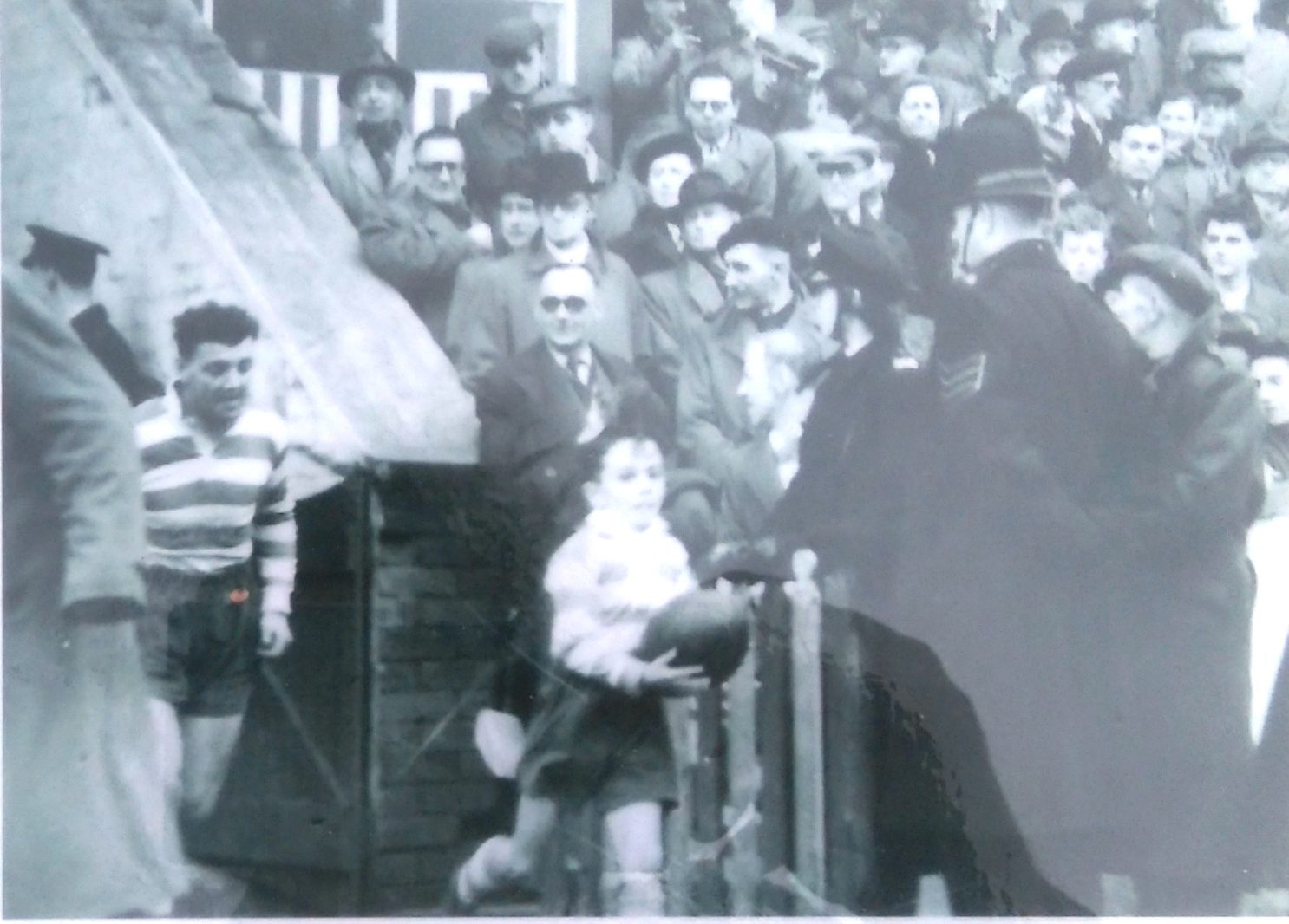 Harry Ogden leads out the team before his benefit match -May 16th 1953.