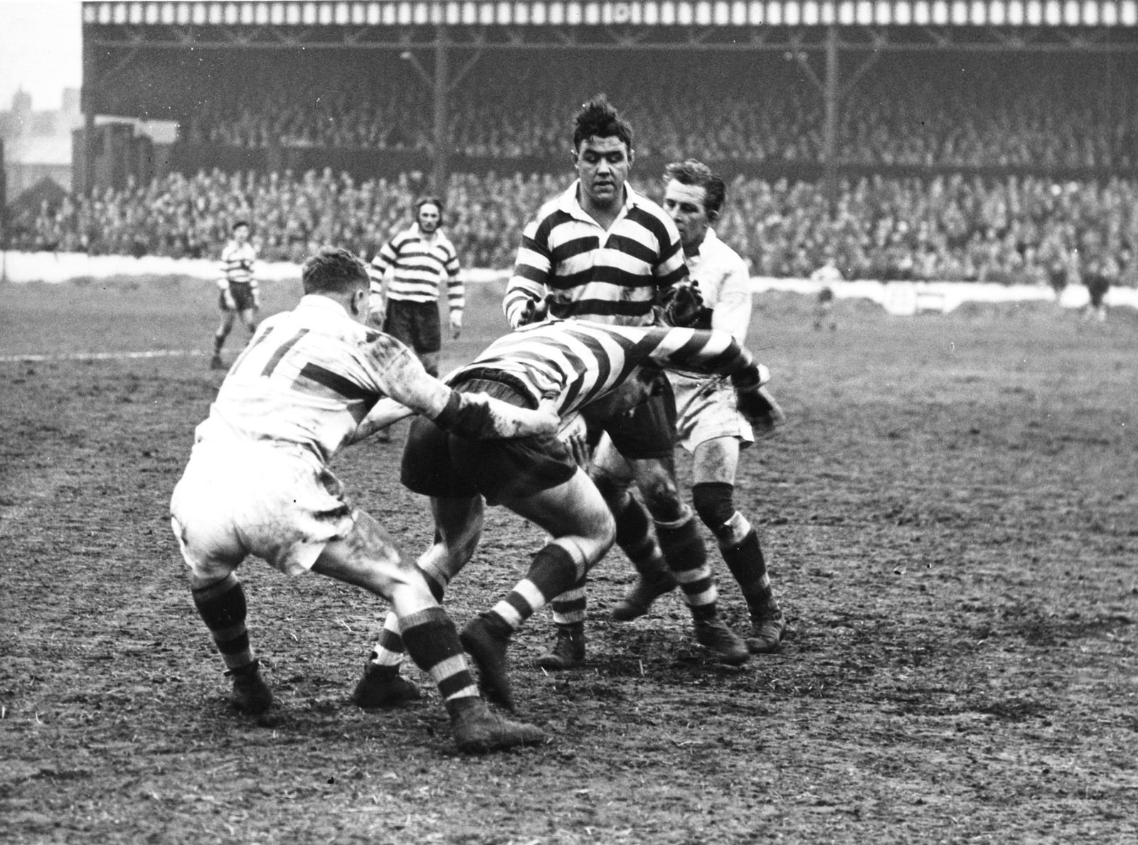 Fairbank tackles Roger Dufty as Ken Jackson looks on - April 7th 1958.