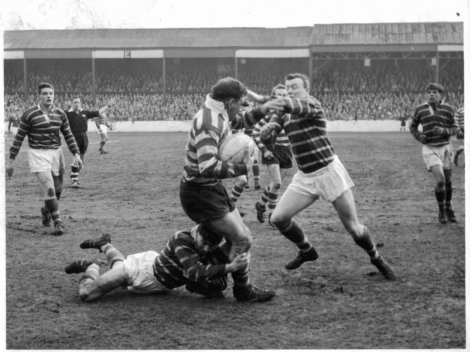Len McIntyre is tackled by Booth and Breen of Huddersfield - April 23rd 1963.