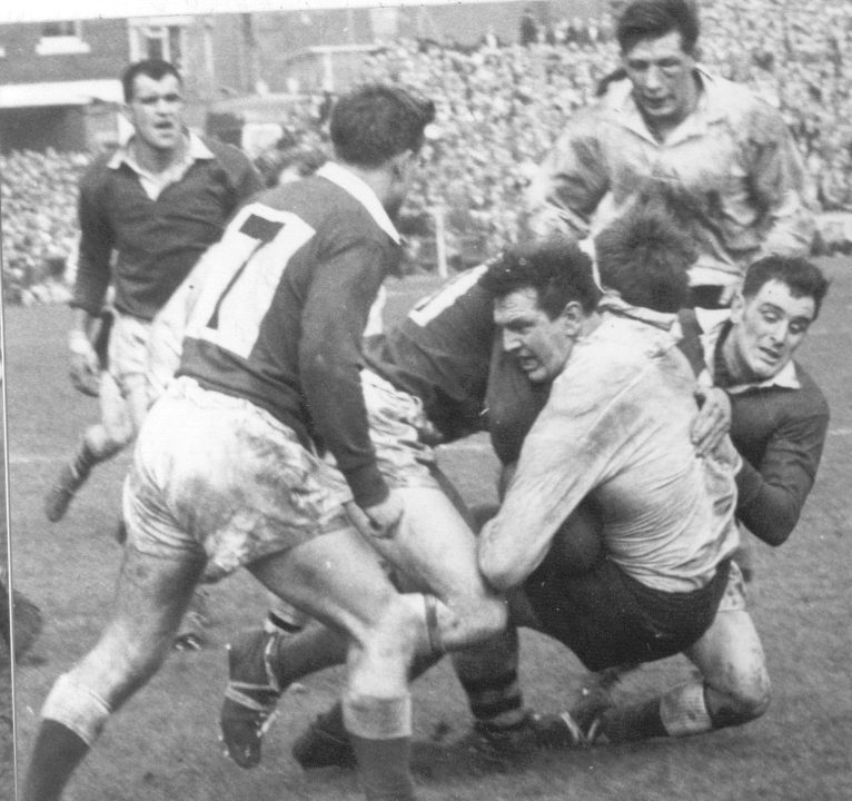 Charlie Bott is well tackled - April 11th 1964.
