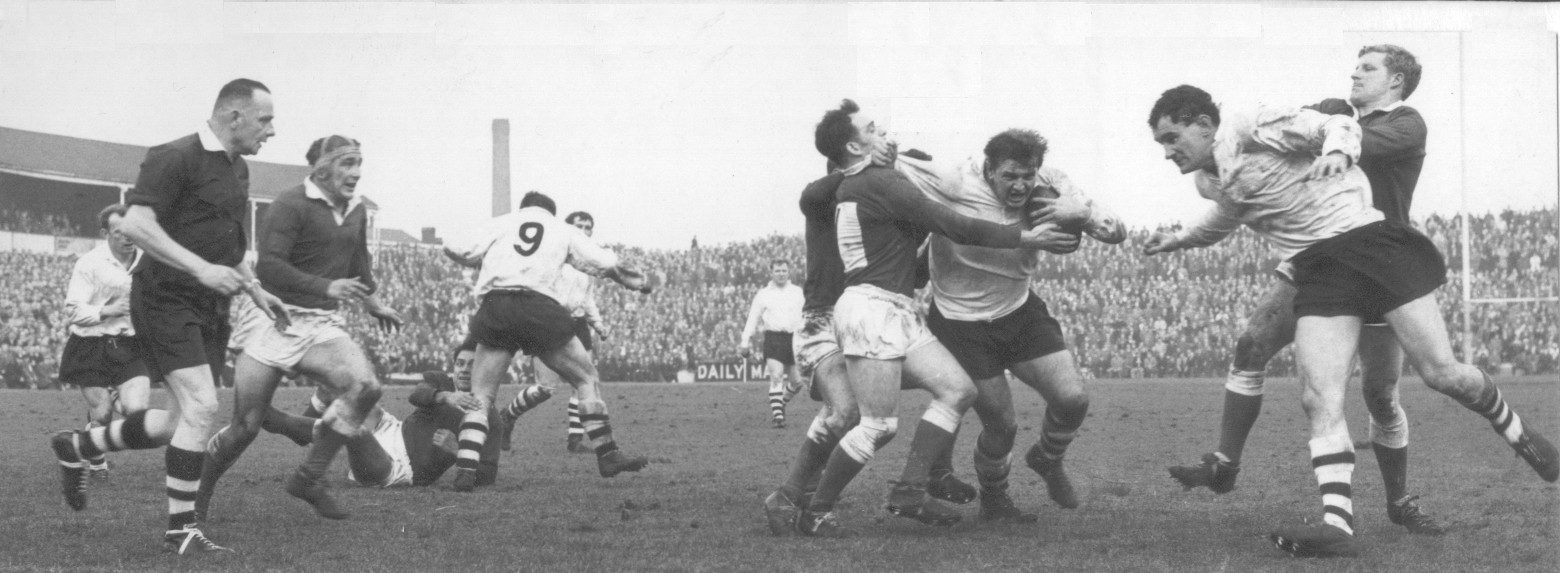 Charlie Bott drives it in as Len McIntyre and Geoff Robinson are occupied elsewhere April 15th 1964.