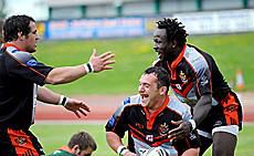 Tommy Goulden (centre) celebrates his try with Simeon Hoyle and Lucas Onyango v Hunslet - June 15th 2008.
