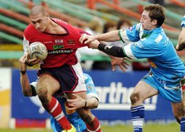 Keighley try all they can to hold back Oldham's Lee Wingfield - March 26th 2006.
