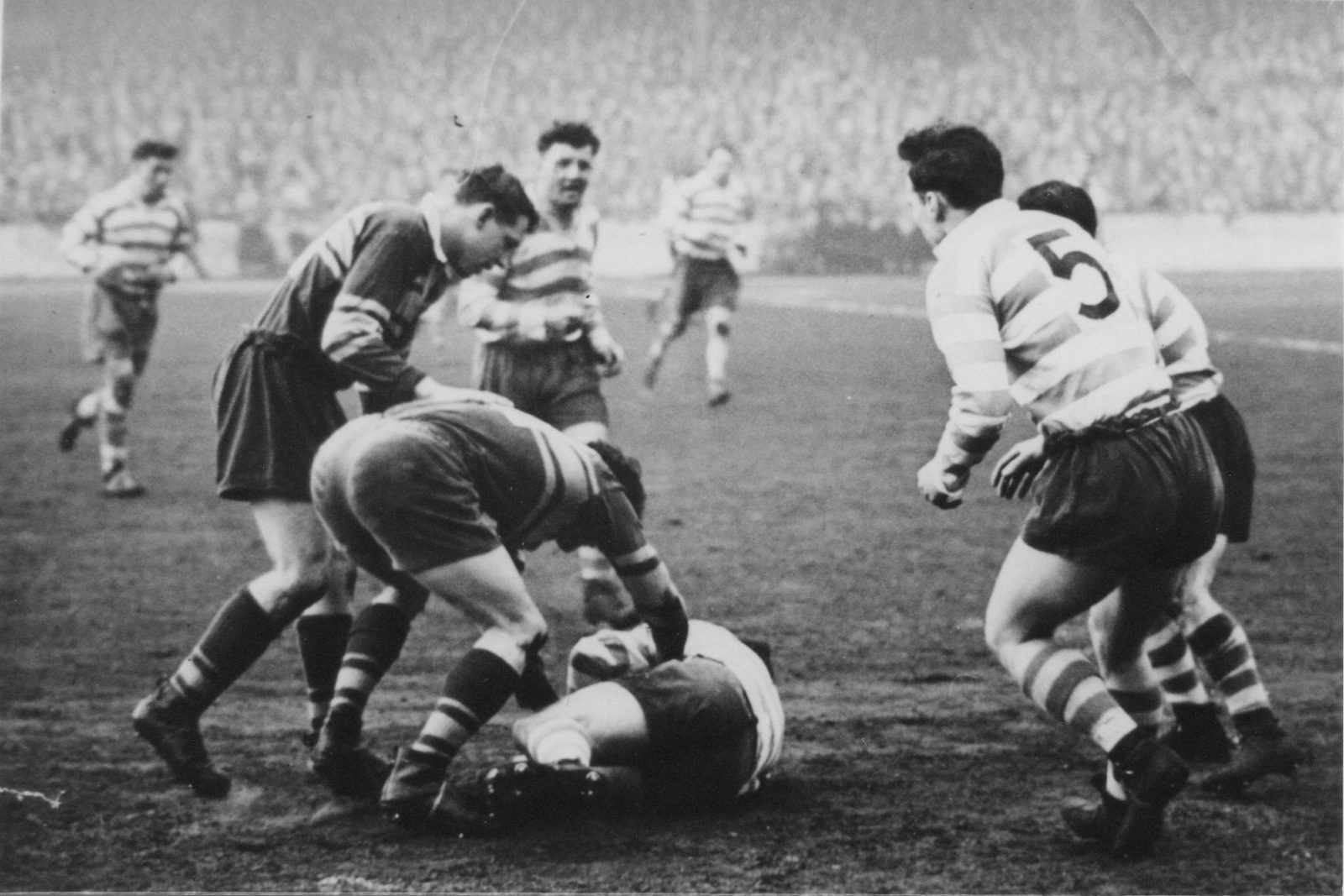 Alan Davies falls to a two-man Leeds tackle with Harry Ogden, Terry O’Grady and Frank Pitchford mostly hidden in attendance - April 23rd 1955.