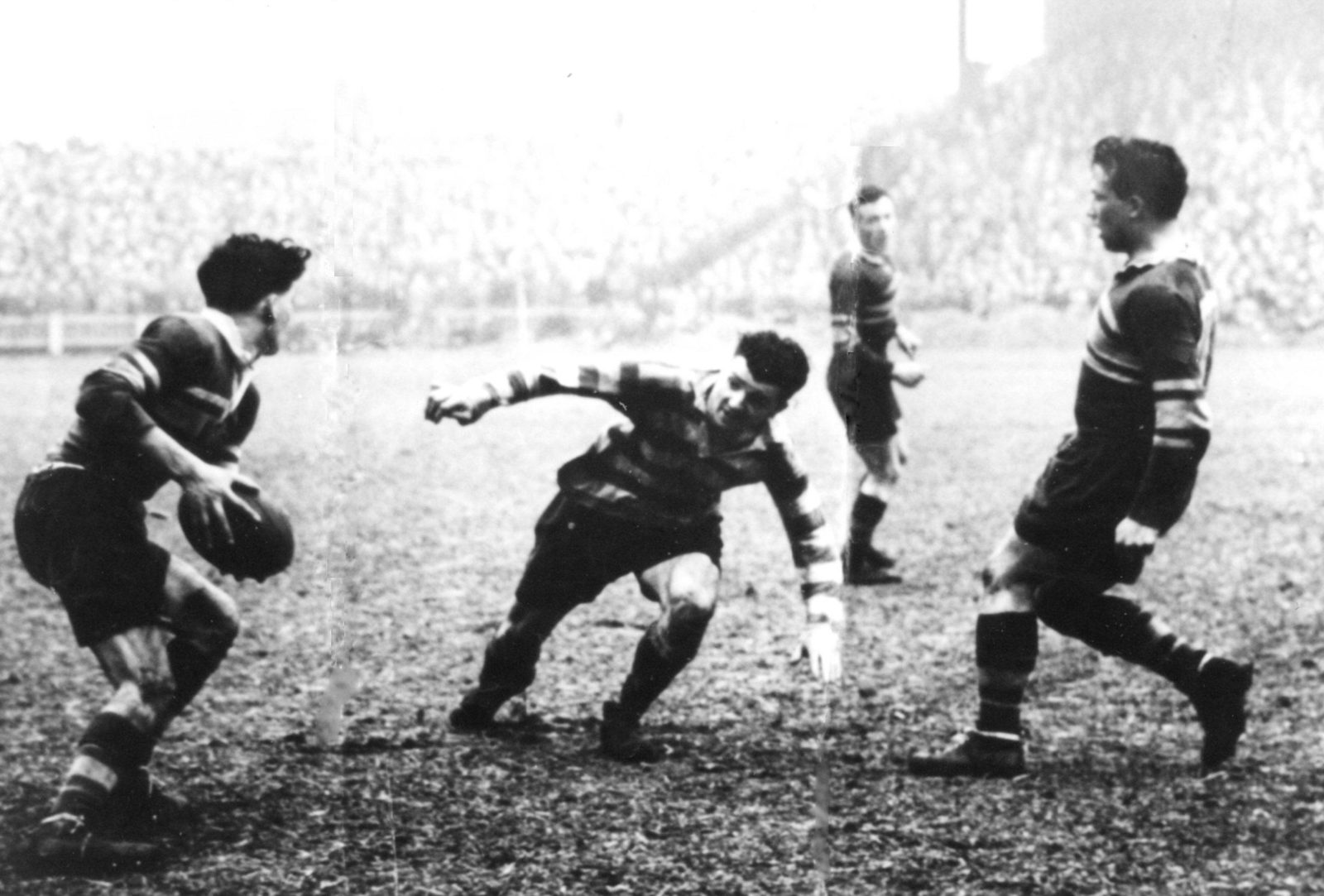 Harry Ogden finds himself surrounded by a trio of Leeds players at Headingley - Sep 10th 1955.
