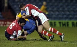 Barrie McDermott and Wayne Corcoran bring down a Leeds player - Jan 27th 2006.