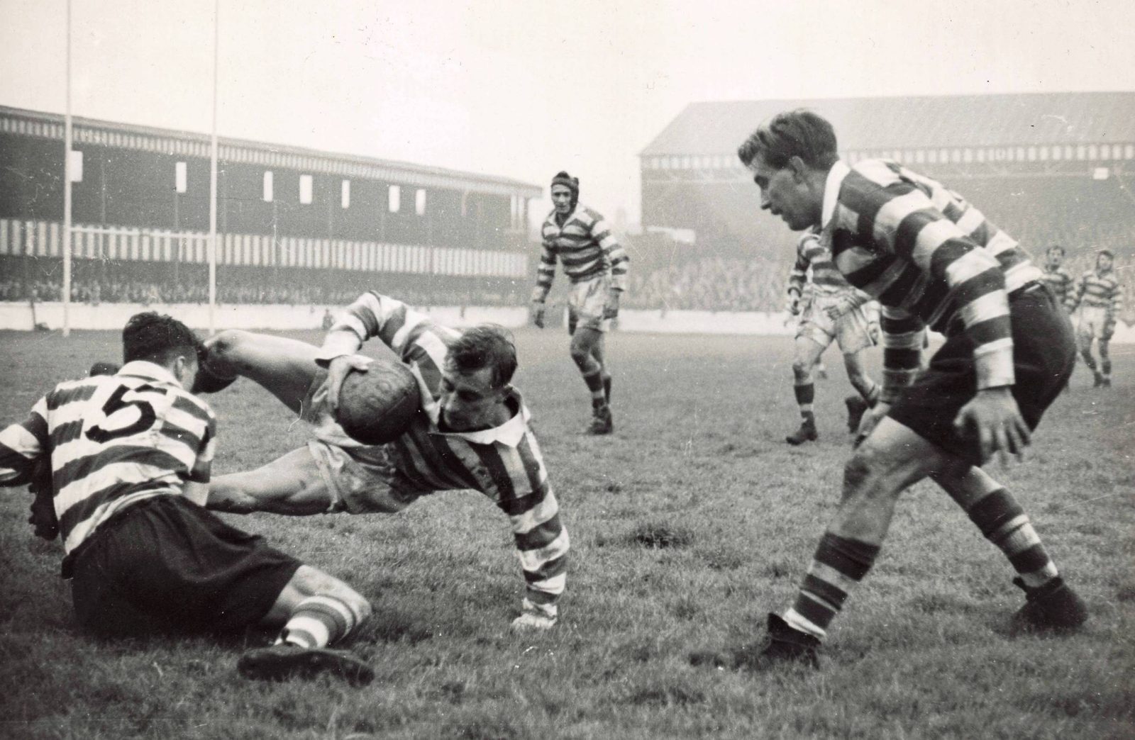 Bill Kindon is tackled by Terry O'Grady with Bryn Goldswain and Trevor Allan paying close attention - Oct 16th 1951.