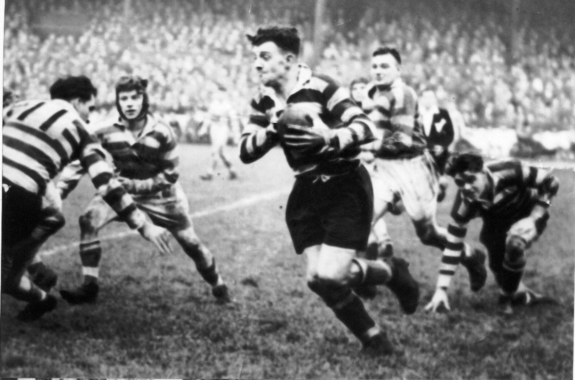 Harry Ogden breaks clear of the Leigh defence with Charlie Winslade (left) and Ken Jackson in attendance - Oct 20th 1951.