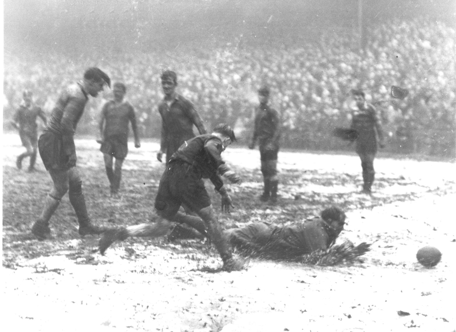 Stan Owen dives through a dejected Oldham defence for the clinching score in the 77th minute - Feb 23rd 1957.