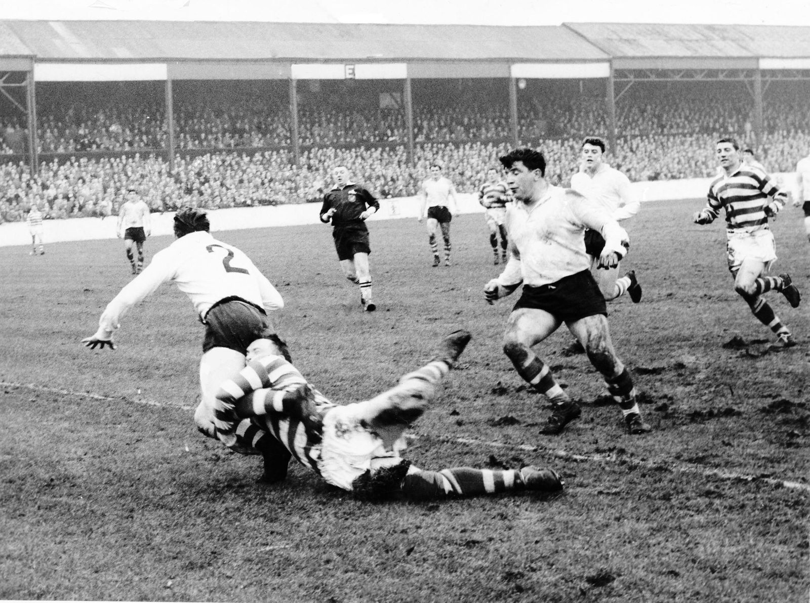 Lewis of Leigh brings down Brian Lord with Peter Smethurst and Malcolm Price in support - Feb 17th 1962..