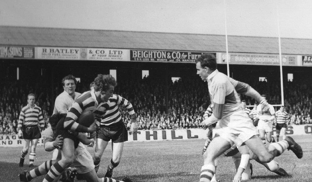 Joe Collins is well tackled v Liverpool on his debut - Sep 12th 1964.