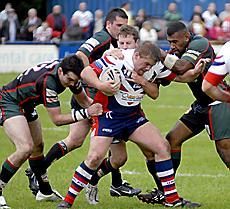 Adam Robinson tries to push away Puna Rasaubale after receiving possession v London Skolars - June 7th 2008.