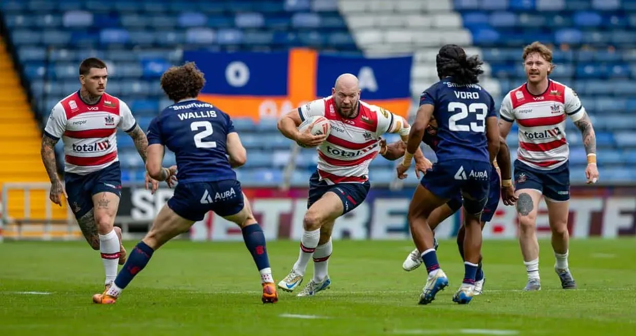 Brad Day takes on the Broncos defence. Ben O'Keefe and Tom Nisbet are in support. Oldham v London Broncos, Sunday August 16, 2026.