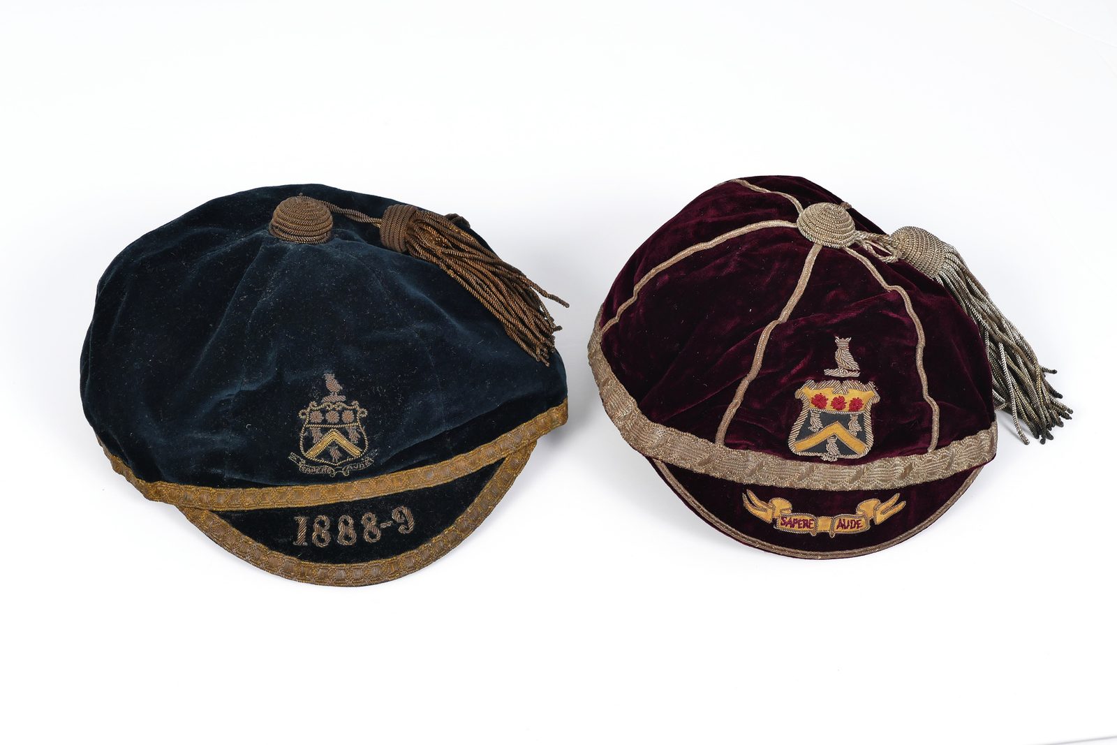 The caps of Ned Blomley. The original green cap was relaced by the plumb colour in the early 1890s.