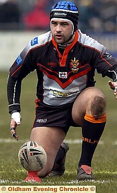 LINING_IT_UP:_Double_centurion_Mick_Nanyn_(above)_prepares_to_kick_at_goal_for_Oldham._Only_three_players_in_the_country_have_more_goals_this_season._