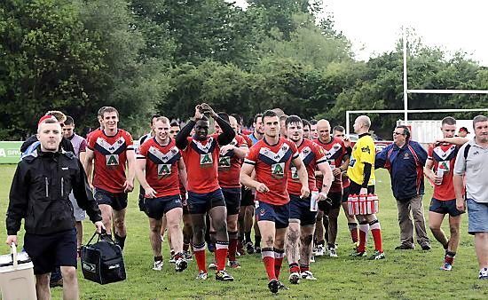 The team celebrate on the pitch at Whitebank - July 28th 2013.