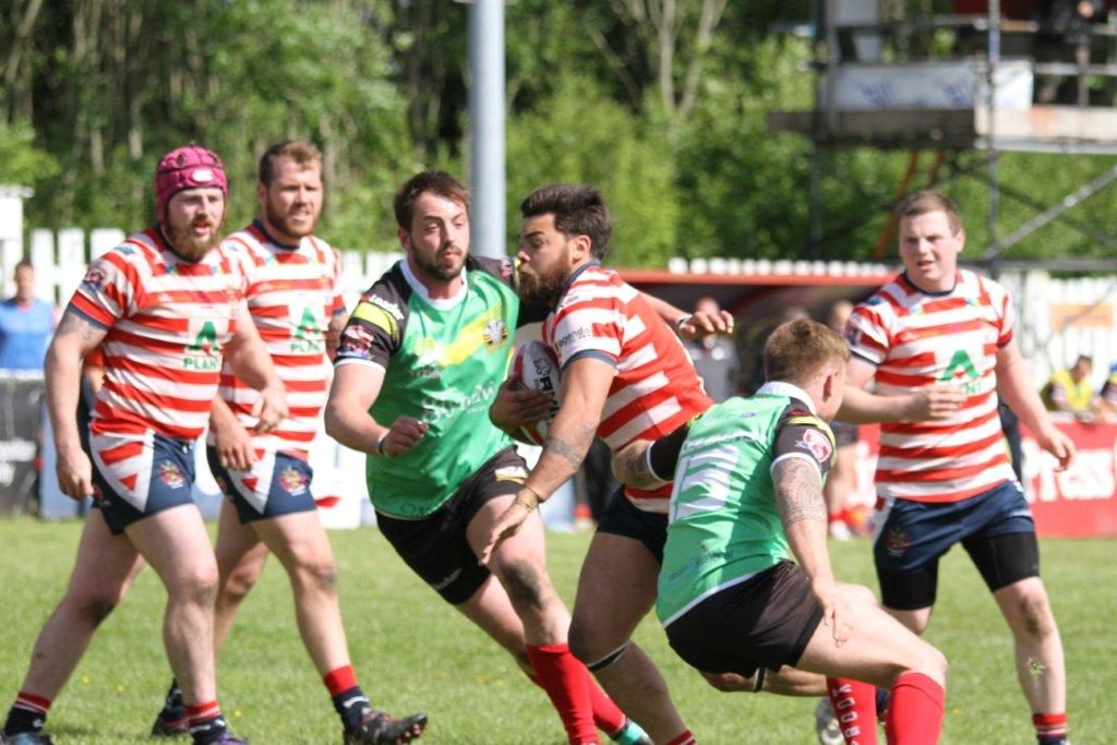 Sam gee in the thick of the action v North Wales - June 7th 2015.