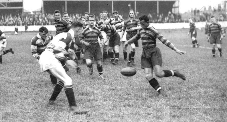 Alex Givvons kicks through in the 1935 Infirmary Cup match at the Athletic Grounds - Aug 24th 1935.