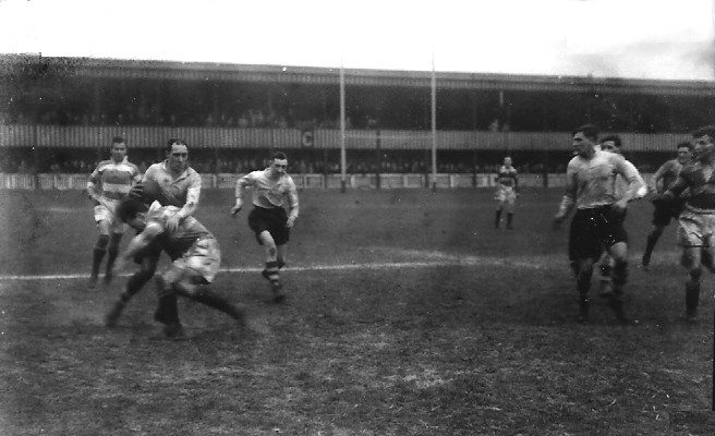 Ken Lowe attempts to evade a Rochdale tackle - April 18th 1938.