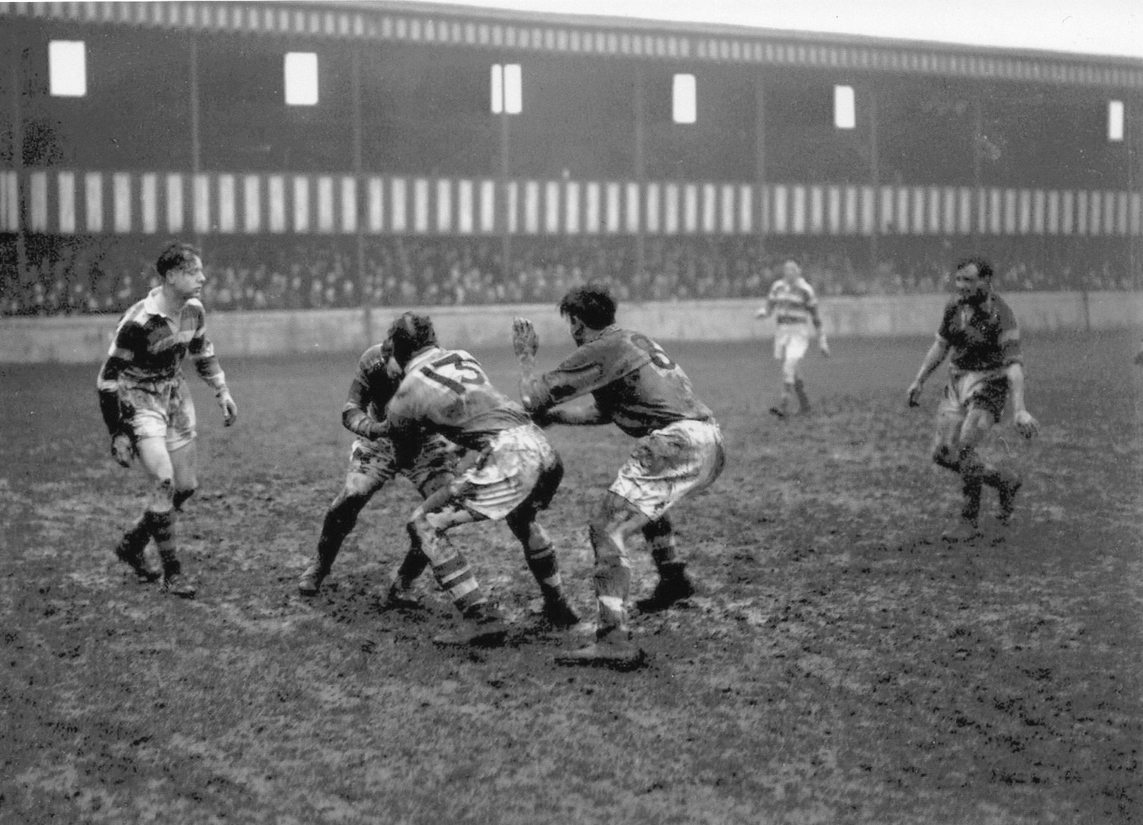 Albert Fearnley (13) and Les Anthony (8) get to grips with a Rochdale player in the first match of the 1950s - Jan 2nd 1950.
