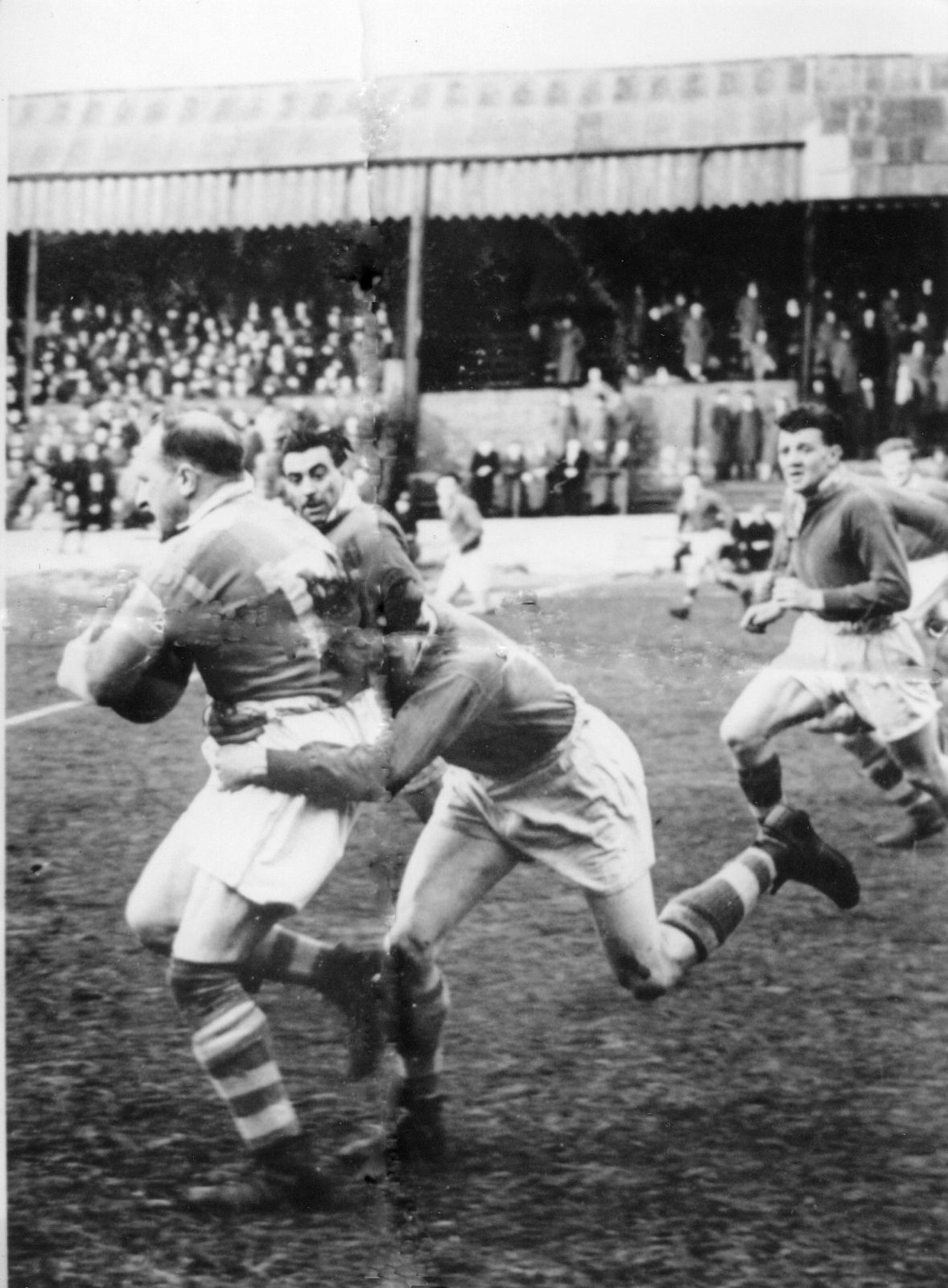 John Rothwell is tackled by Lawrie Platt as Bryn Goldswain and Harry Ogden move up to support the wingman - April 30th 1951.