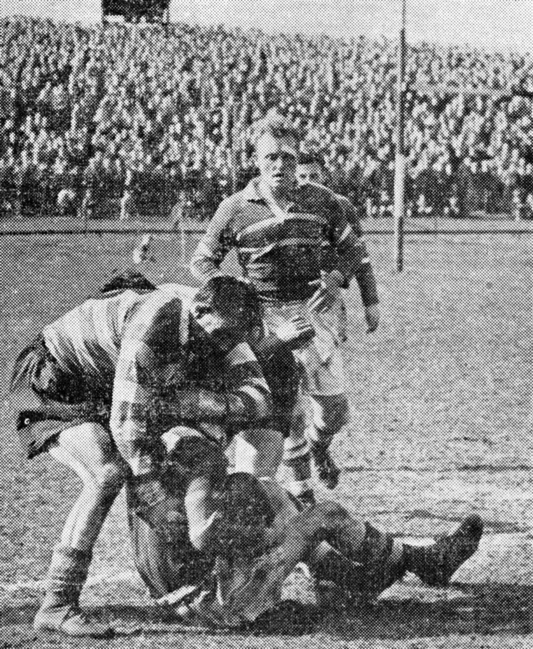 Bryn Goldswain puts paid to a Rochdale attack at a packed Athletic Grounds - April 19th 1954.