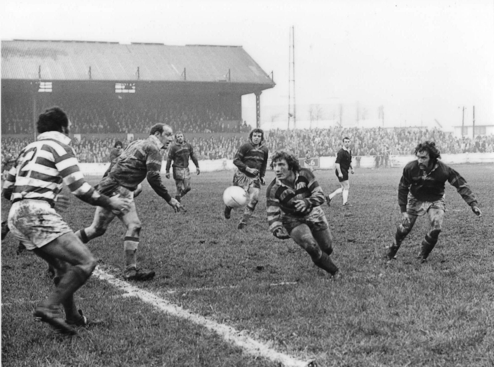 Kevin Taylor releases a pass to Mike Elliott at the Athletic Grounds - Feb 23rd 1975.