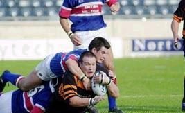 Danny Guest goes down in a two man tackle v Rochdale - Sep 22nd 2002.