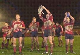 The players celebrate with the Law cup - Dec 29th 2002.
