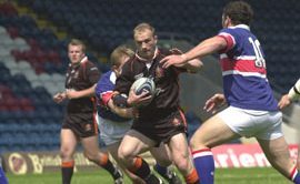 Oldham's Keith Brennan looks for a way through the Rochdale defence - June 29th 2003.