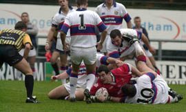 Oldham forward Lee Doran finds a way through a packed Rochdale defence to score the first try of the Law Cup game at Boundary Park - Jan 18th 2004.