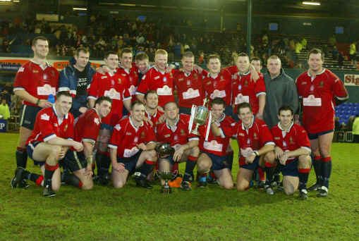 The players celebrate with the Law Cup - Jan 18th 2004.