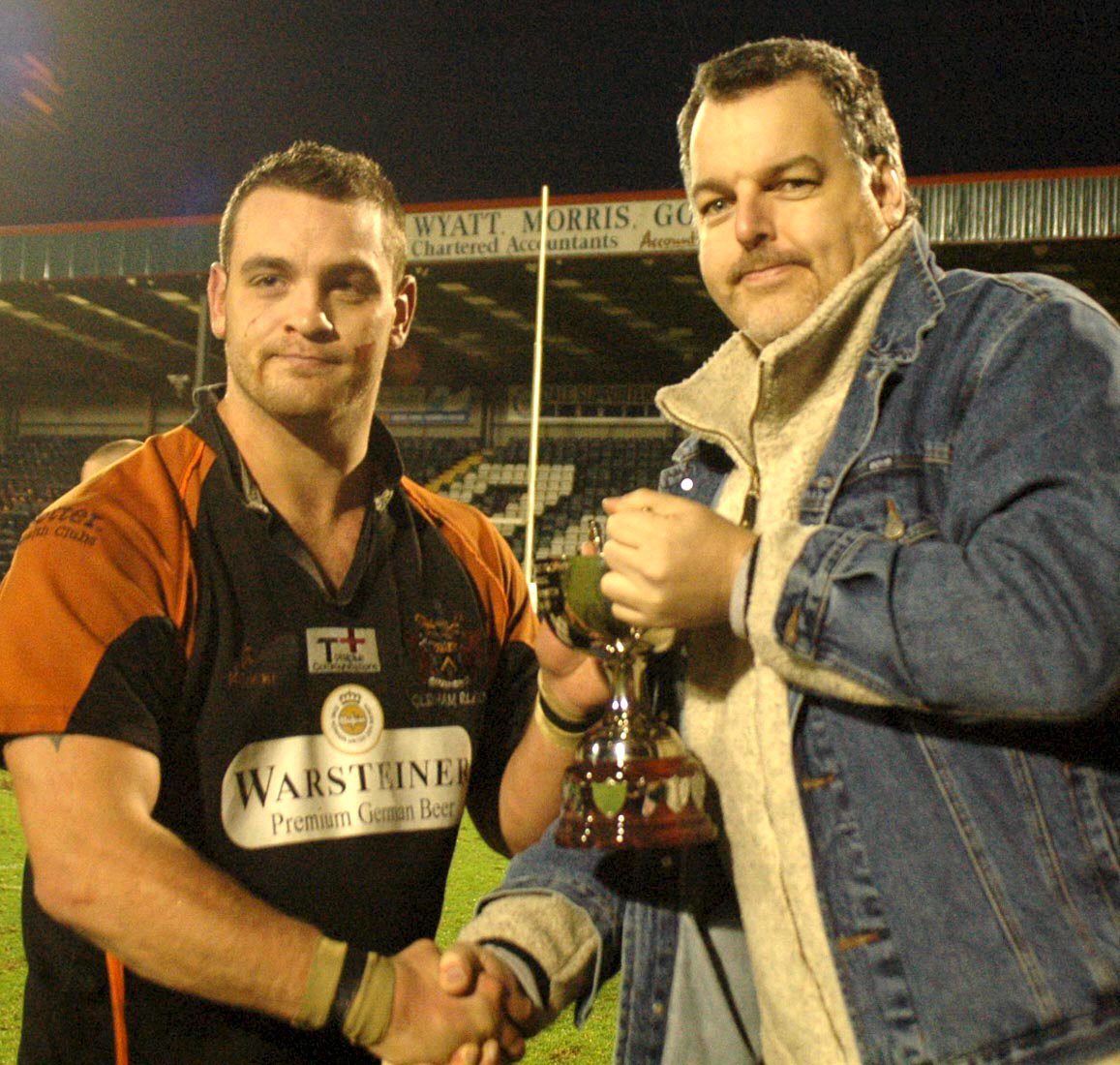Tim Hughes presents the Heritage Trust Trophy to Andy Isherwood at Spotland - Jan 9th 2005.