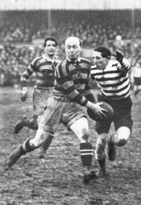 Evan Davies goes to tackle George Prudence at Watersheddings - possibly 1919.