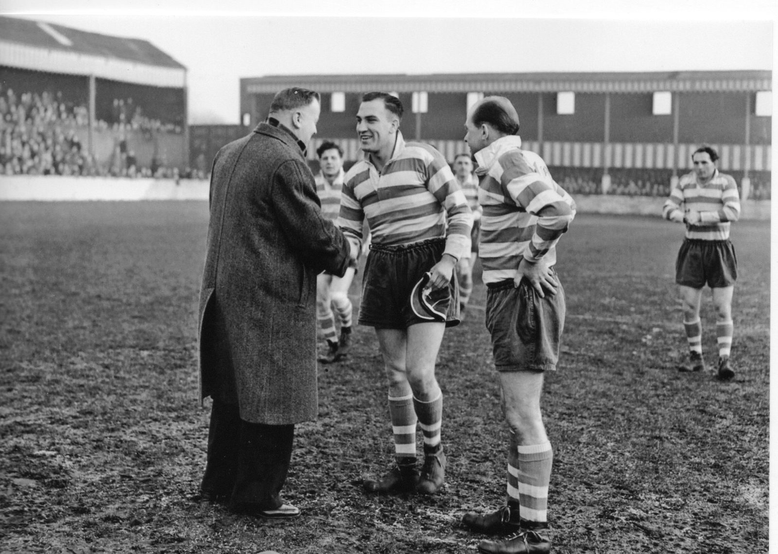 Club official Percy Carter presented Welsh caps to forwards Charlie Winslade and Bryn Day before the match against Salford - Nov 22nd 1952.