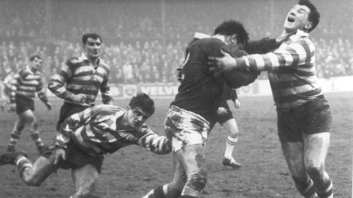 Peter Smethurst receives a hand-off from Evans of Salford as Geoff Crowther goes low - Jan 25th 1964.