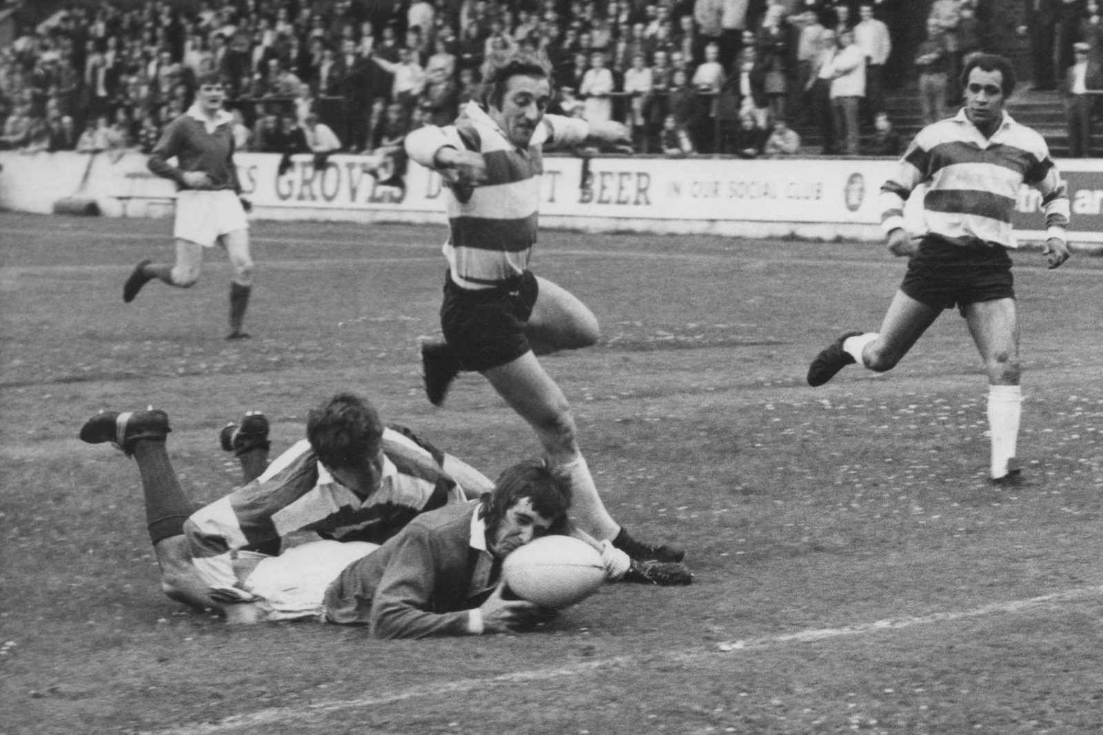 Salford's Phil Orr is tackled just short of the line by Alan Ogden while Jos Collins and Mike Elliott look on - July 27th 1971.